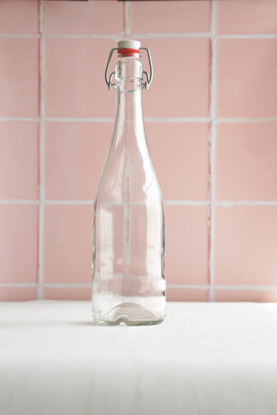 BOTELLA DE VIDRIO ALTA CON CIERRE HERMETICO